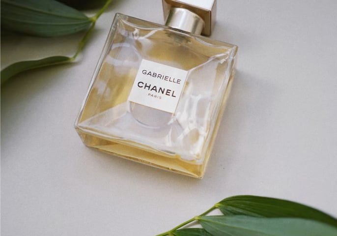 A Chanel perfume on a white surface